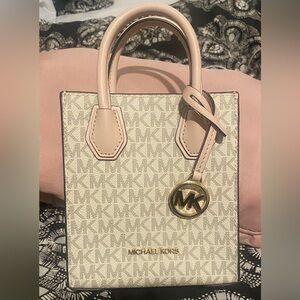 Michael Kors light pink Mini crossover/handbag